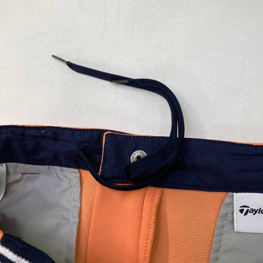サイズ：XS TAYLOR MADE テーラーメイド 2023年モデル ロングパンツ  オレンジ系 [240101383552] ゴルフウェア レディース ストスト サイズ：XS TAYLOR MADE テーラーメイド 2023年モデル ロング