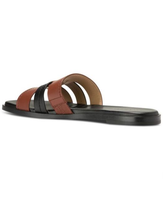 送料無料 コールハーン レディース サンダル シューズ Women s Flynn Slotted Slide Flat Sandals Dark Cuoio Black Leather KIN-KAAI_COM