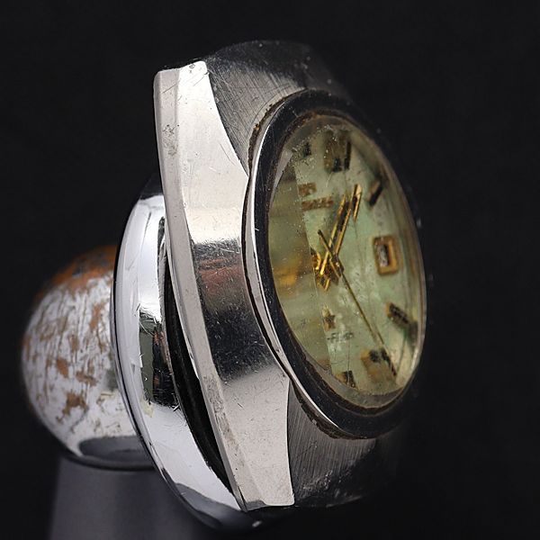 テクノス AT/自動巻 ファイヤーフラッシュ ゴールド系文字盤 デイデト カットガラス ラウンド メンズ腕時計IKE