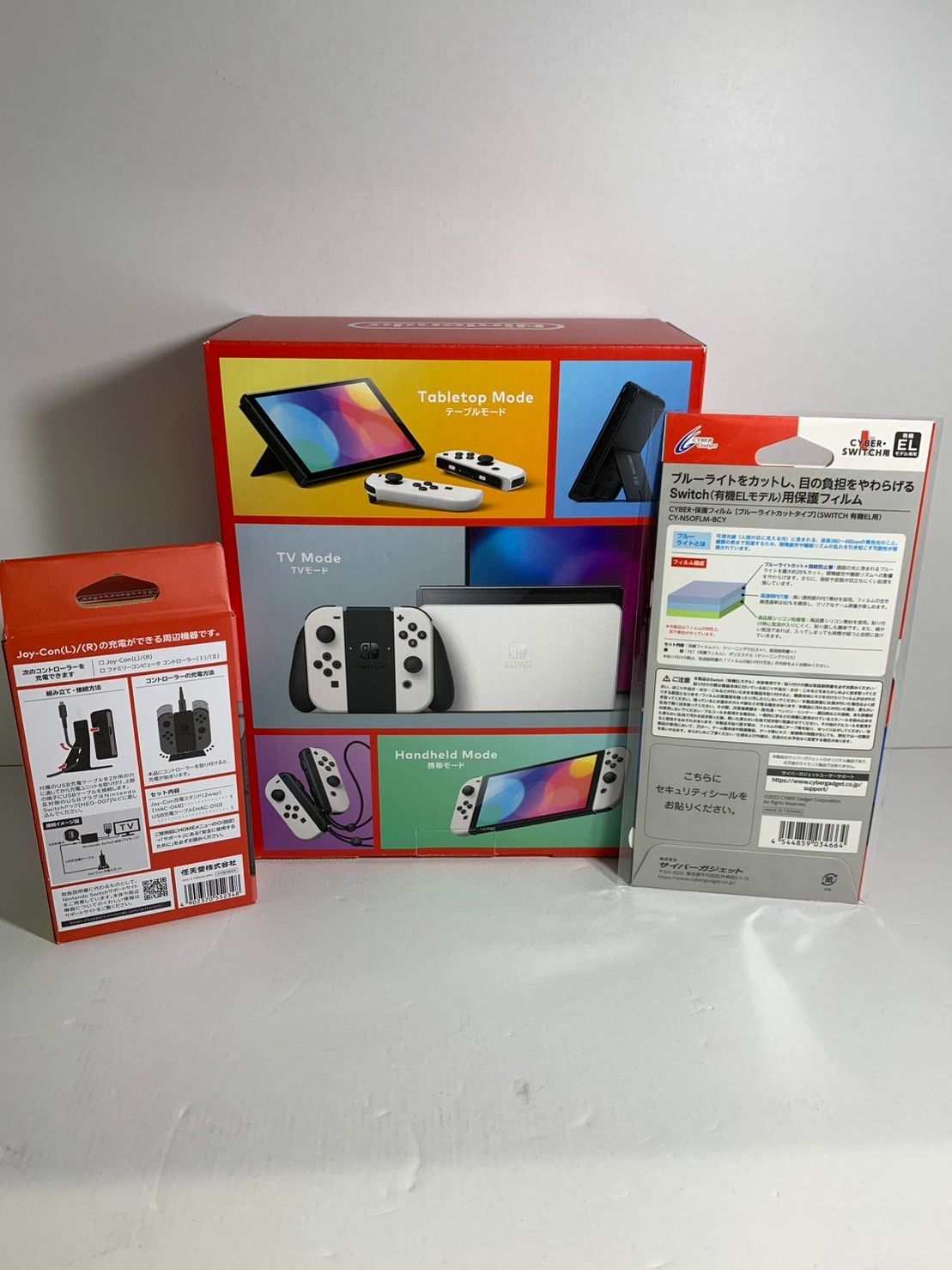 25.Nintendo Switch 有機ELモデル Joy-Conホワイト 充電スタンド 保護フィルム付き 併売品