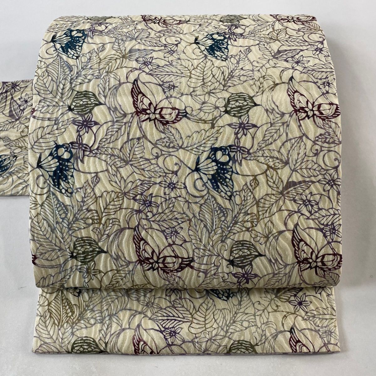 名古屋帯 秀品 紬地 草花 花唐草 相良刺繍 汕頭刺繍 茶色 正絹(仕立て