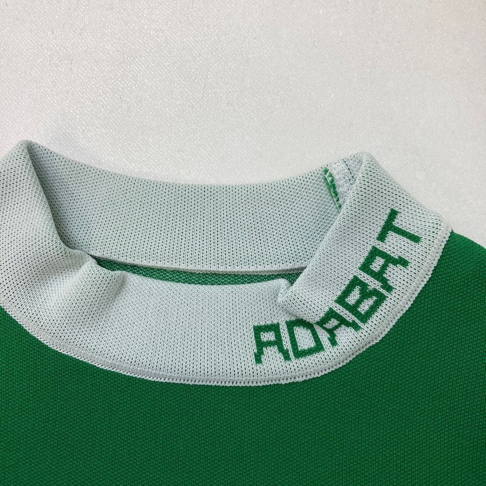 サイズ：36 ADABAT アダバット  半袖ハイネックニットTシャツ  グリーン系 [240101460261] ゴルフウェア レディース ストスト サイズ：36 ADABAT アダバット 半袖ハイネックニットTシャツ