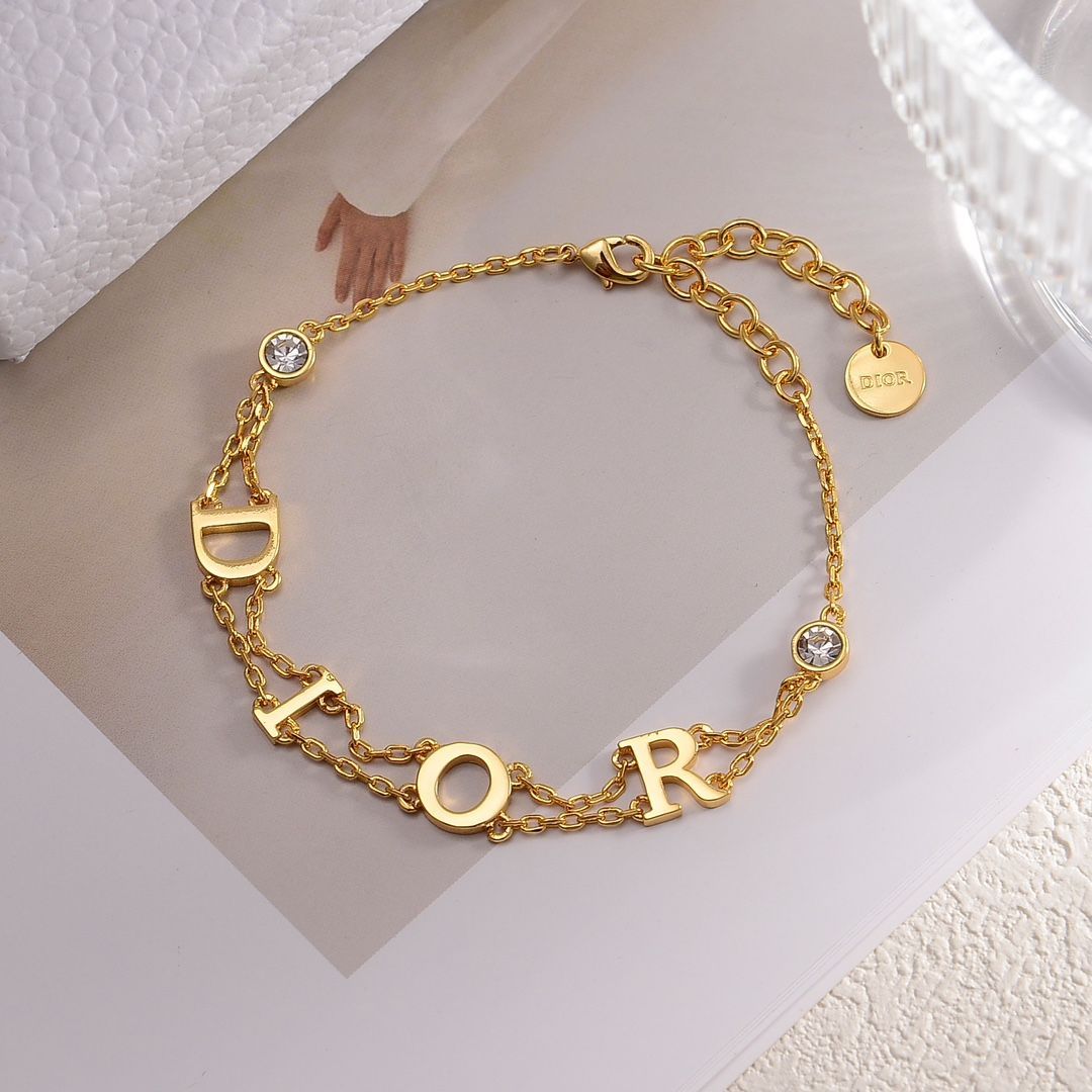新品未使用】DIOR(ディオール) ゴールドトーン ロゴ クリスタル 