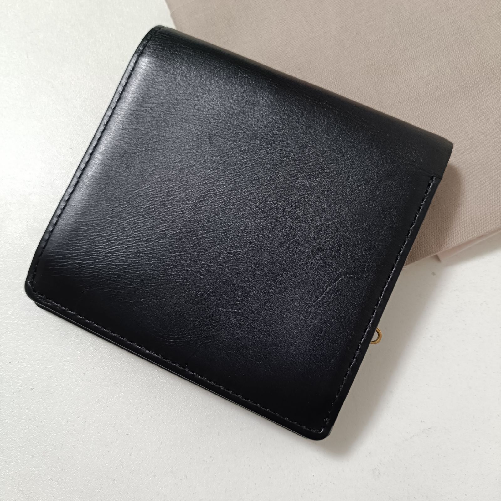 オメガ 本革レザー 二つ折り財布 ブラック 美品 - メルカリ