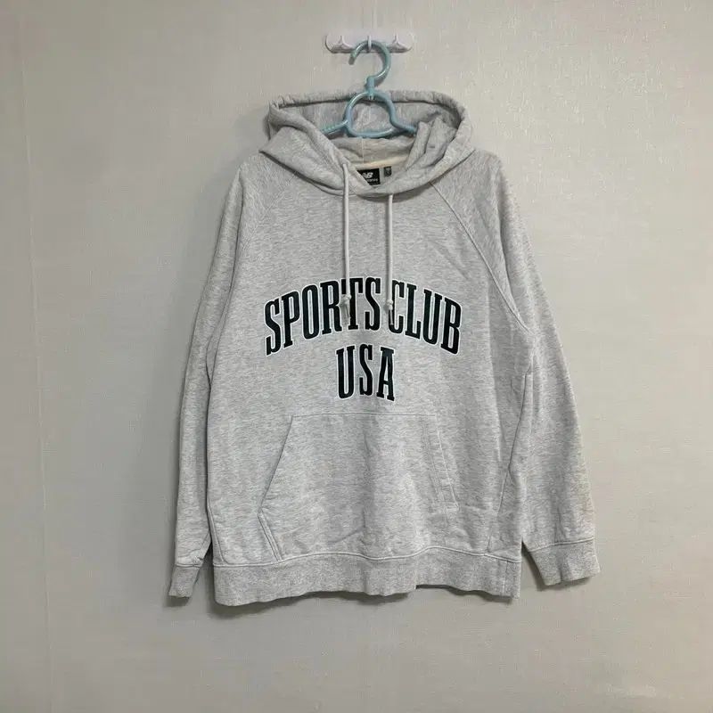 100 New Balance(ニューバランス) usa ロゴ フード付きTシャツ