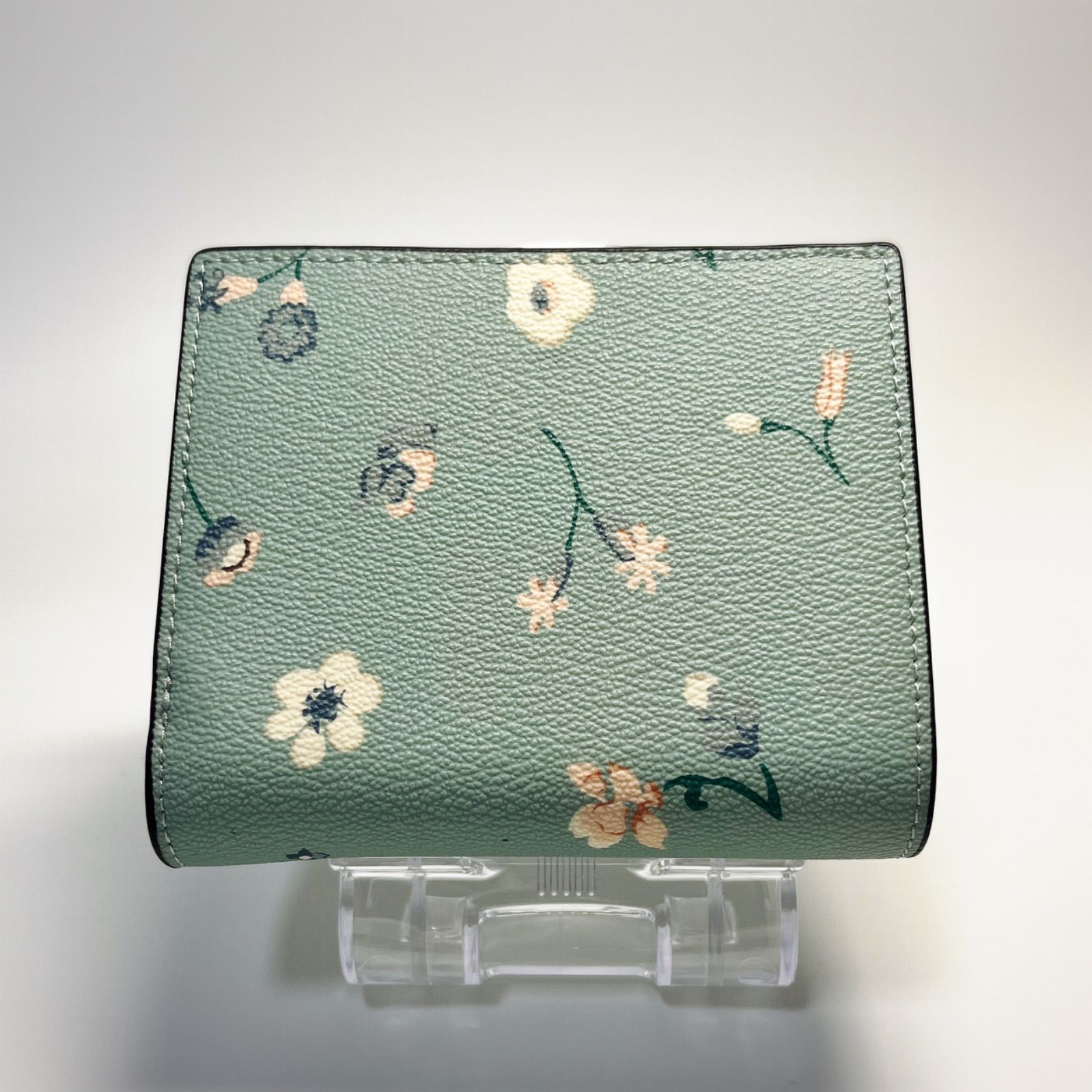 新品・国内在庫】 COACH コーチ 二つ折り財布 花柄 水色 ブルー C8703