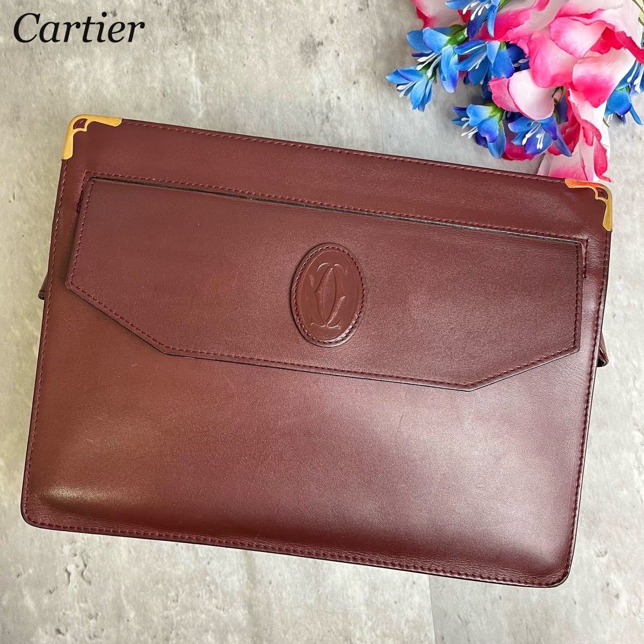 ✨美品✨ Cartier カルティエ クラッチバッグ ハンドバッグ マストライン 総柄 ゴールド金具 ロゴプレート ロゴ型押し カーフレザー  ユニセックス メンズ レディース ボルドー 濃い赤色