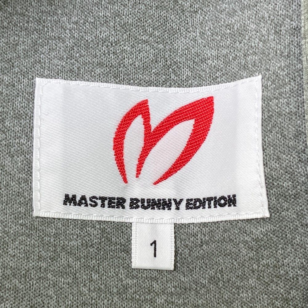 サイズ：1 MASTER BUNNY EDITION マスターバニーエディション 10周年 ジップパーカー ロゴ 総柄 グレー系 [240101449692] ゴルフウェア レディース ストスト サイズ：1 MASTER BUNNY EDITION マスターバニーエディション 10