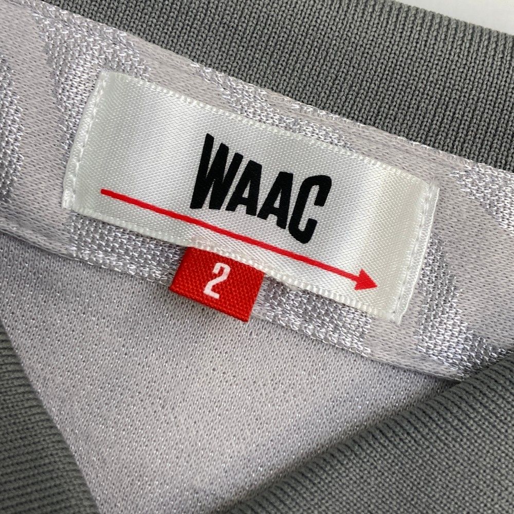 サイズ：2 WAAC ワック  半袖ポロシャツ 迷彩 カモフラ柄 グレー系 [240101452244] ゴルフウェア レディース ストスト サイズ：2 WAAC ワック 半袖ポロシャツ 迷彩 カモフラ柄 グレー