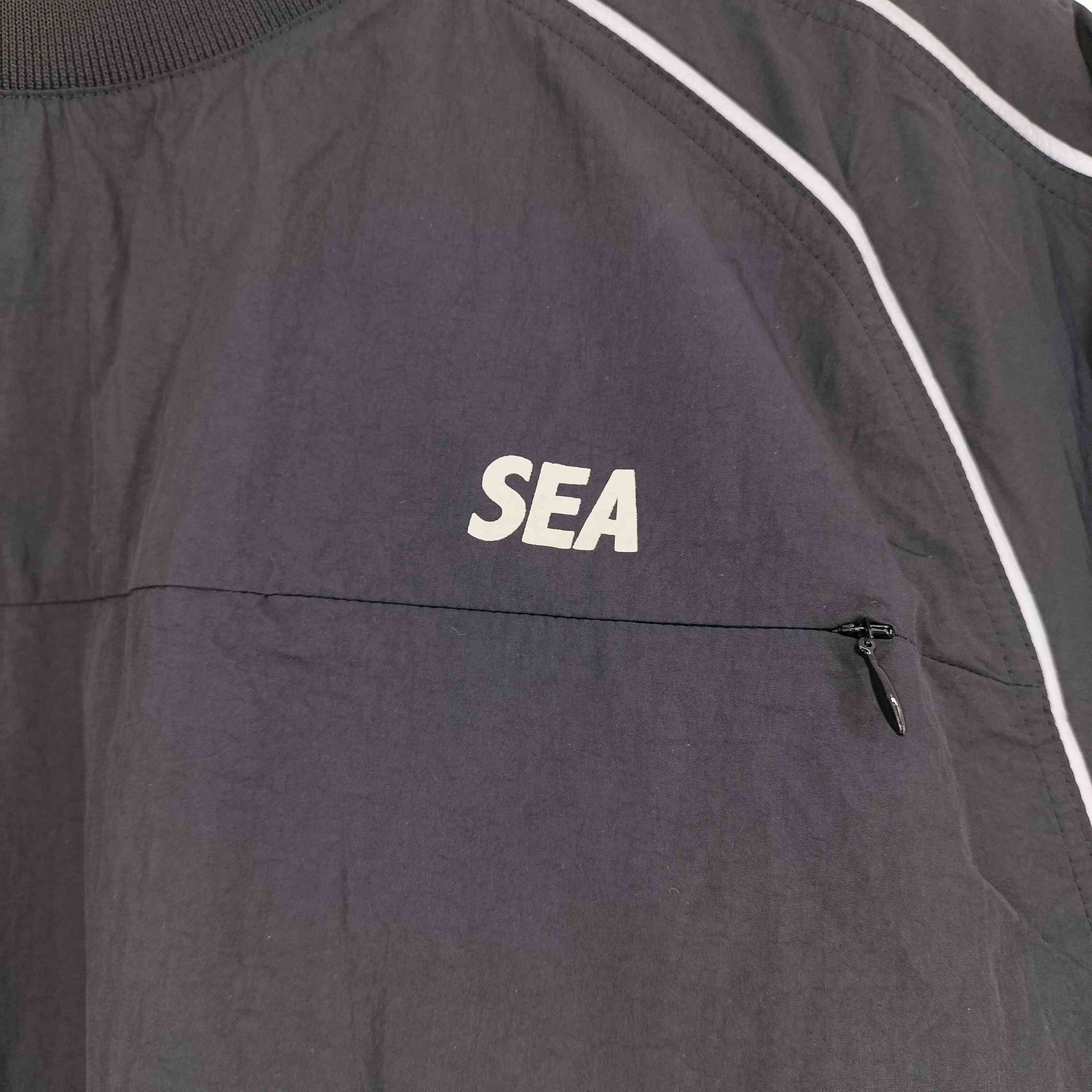 ウィンダンシー WIND AND SEA REFLECTIVE PIPING TRACK S/S TOP メンズ