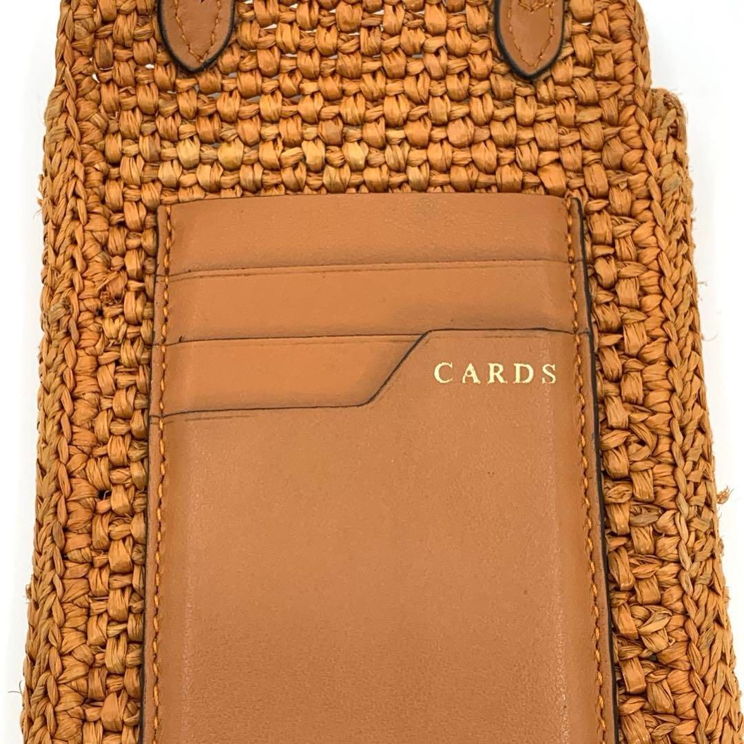 アニヤハインドマーチ スマホショルダーバッグ アイズ オレンジ ラフィア DECORATOM_COM_BR