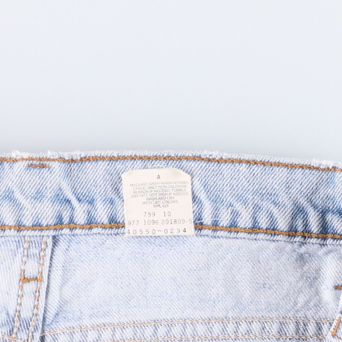 オレンジタブ テーパードデニムパンツ