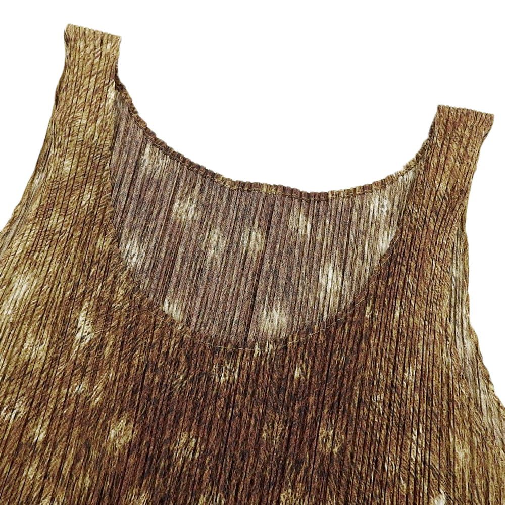PLEATS PLEASE