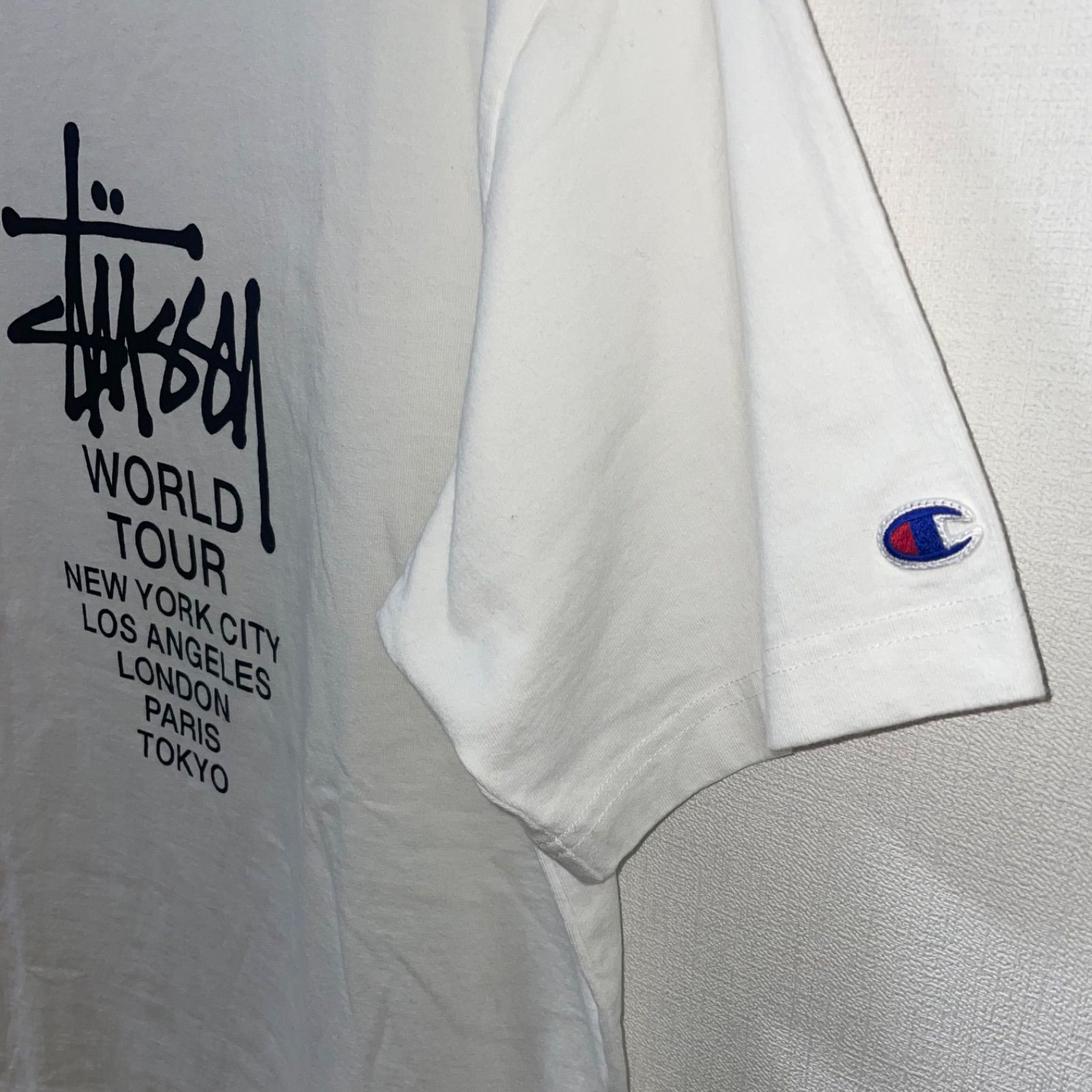 STUSSY × CHAMPION / WORLD TOUR TEE - メルカリ