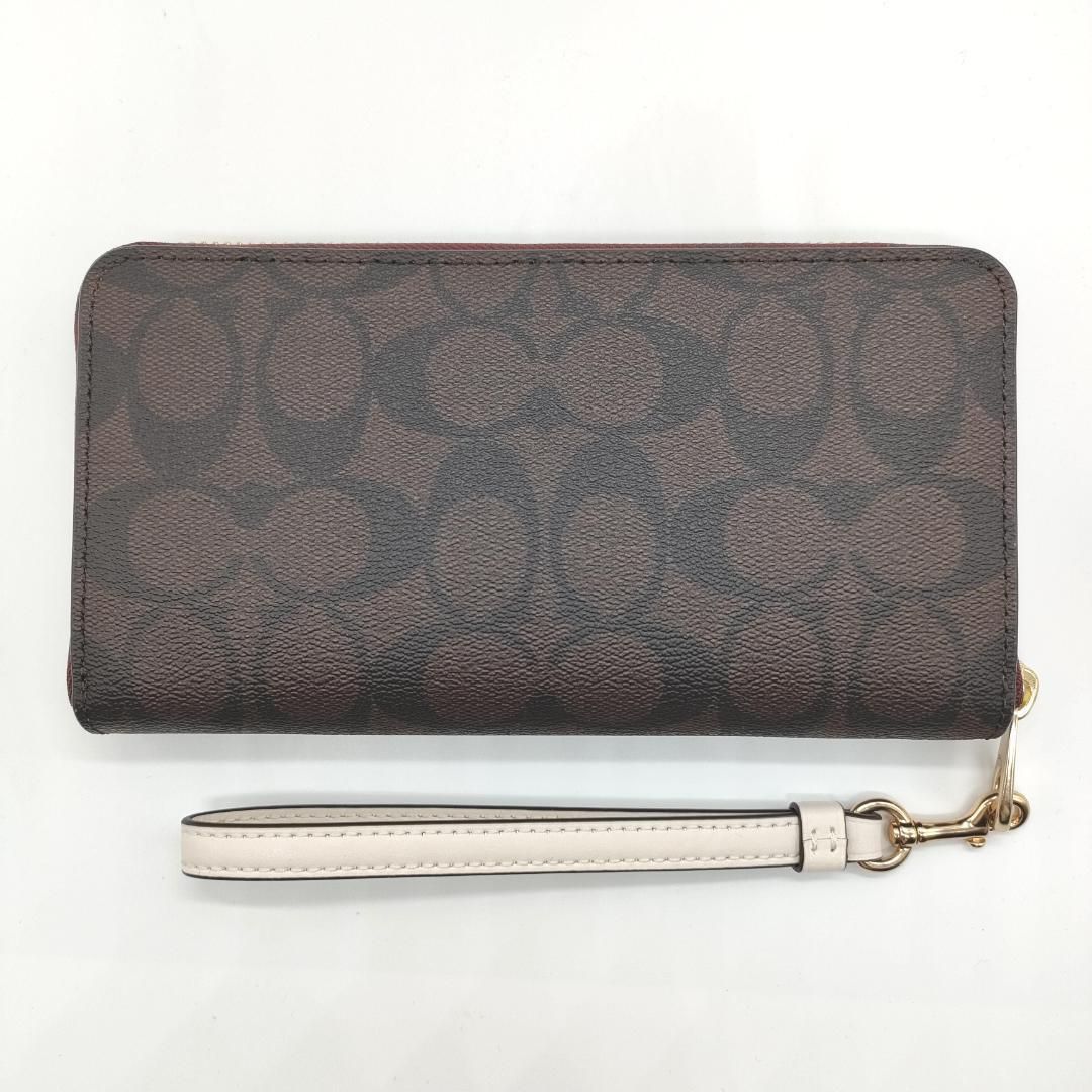 COACH] コーチ シグネチャー柄 ラウンドジップ長財布 CB856（ブラウン