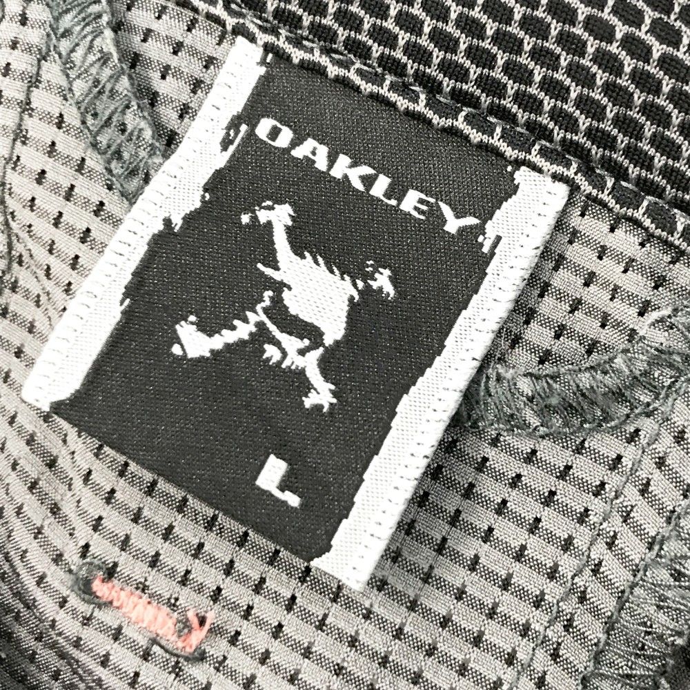 サイズ：M OAKLEY オークリー 半袖ポロシャツ 総柄 グレー系