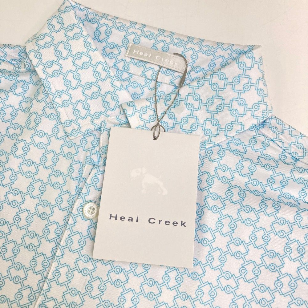 サイズ：48 HEAL CREEK ヒールクリーク  半袖ポロシャツ 総柄 ホワイト系 [240101449145] ゴルフウェア メンズ ストスト サイズ：48 HEAL CREEK ヒールクリーク 半袖ポロシャツ 総柄