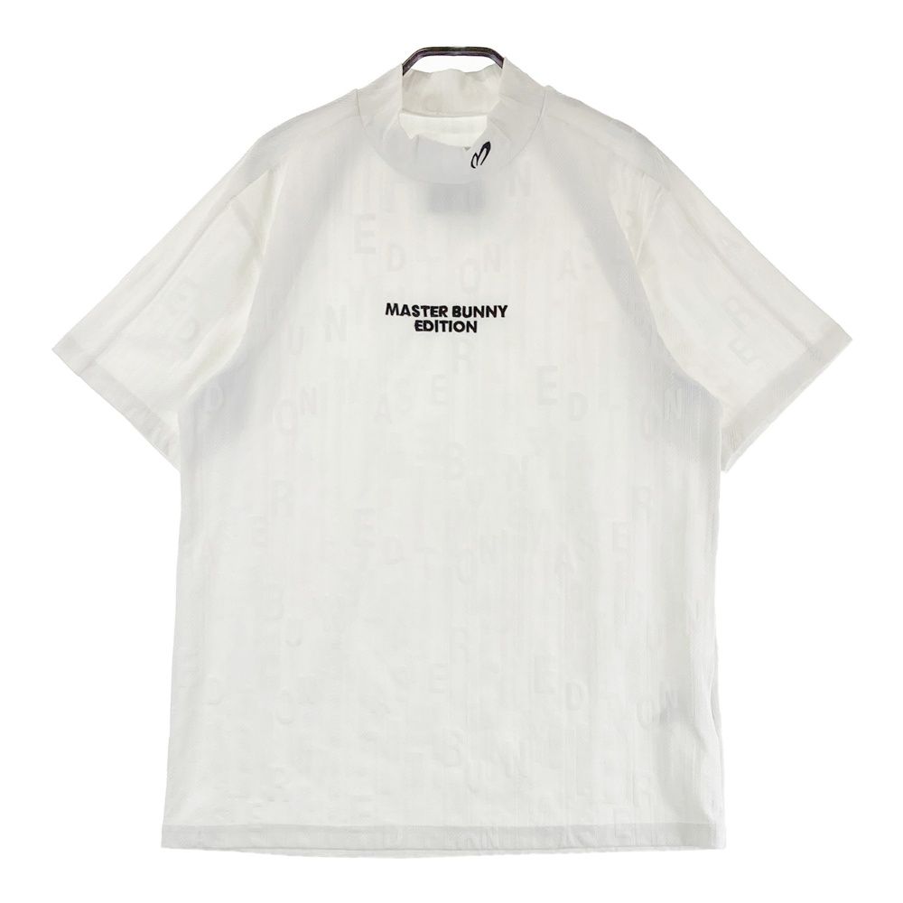 サイズ：5 MASTER BUNNY EDITION マスターバニーエディション  モックネック半袖Tシャツ ロゴ総柄 ホワイト系 [240101486384] ゴルフウェア メンズ ストスト サイズ：5 MASTER BUNNY EDITION マスターバニーエディション