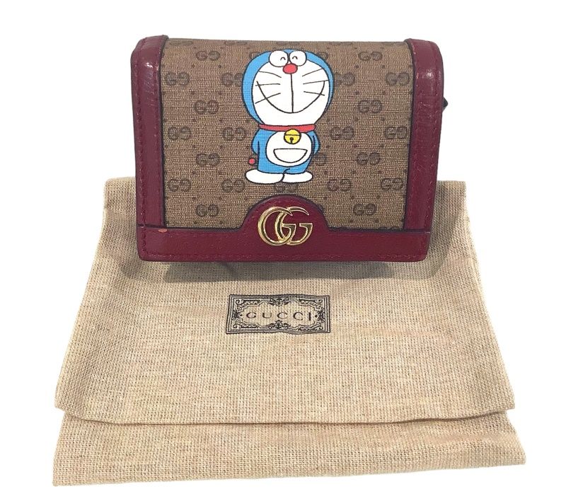 GUCCI グッチ財布ドラえもん×グッチ 647788 ミニGGスプリーム コンパクトウォレット コラボ 折財布【中古】KB-7876 - メルカリ