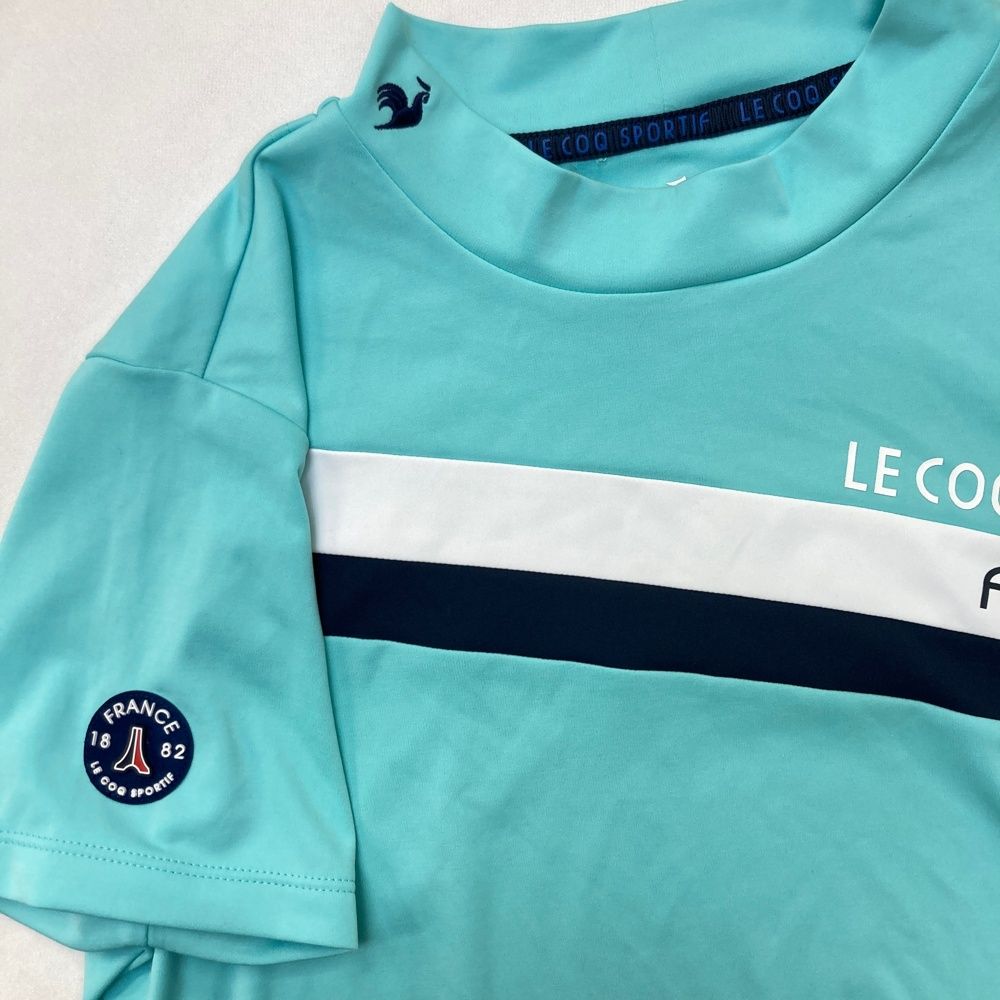 サイズ：L LE COQ GOLF ルコックゴルフ 2024年 モックネック 半袖Tシャツ  ブルー系 [240101530148] ゴルフウェア レディース ストスト