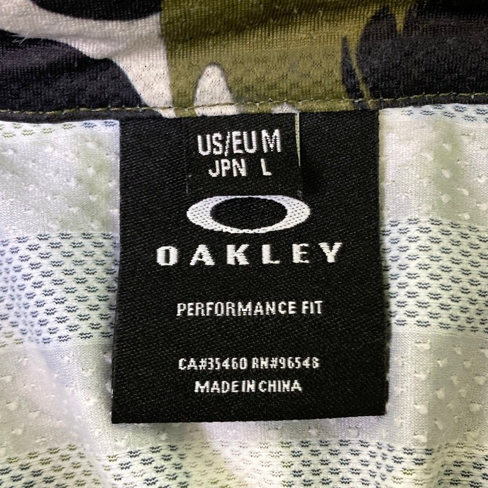 サイズ：L OAKLEY オークリー 半袖ポロシャツ 総柄 カーキ系
