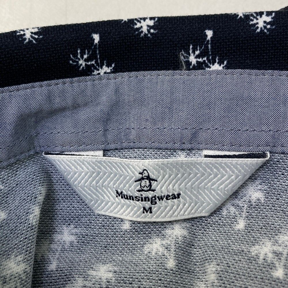 サイズ：M MUNSING WEAR マンシングウェア  半袖ワンピース ヤシ柄 ネイビー系 [240101450618] ゴルフウェア レディース ストスト サイズ：M MUNSING WEAR マンシングウェア 半袖ワンピース ヤシ