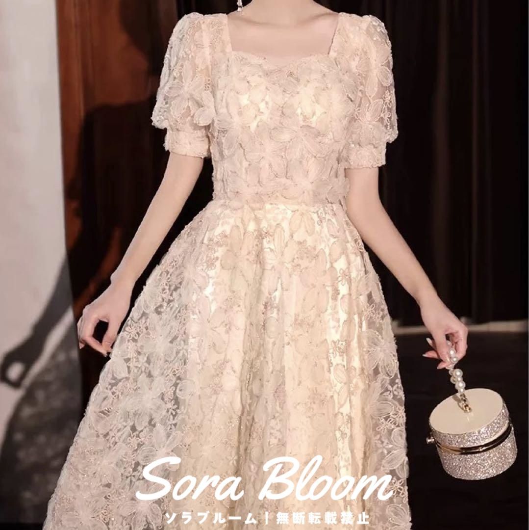お花のデザインが パフスリーブのイブニングドレス?.?