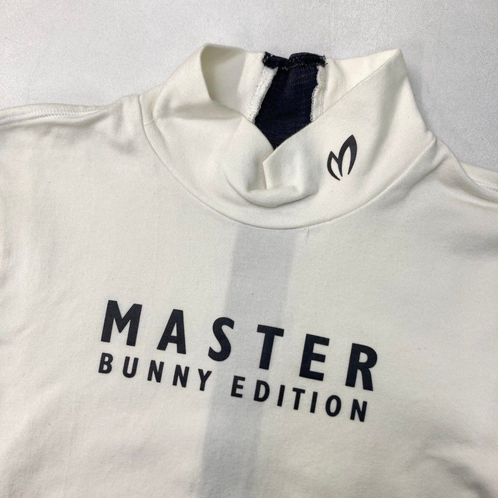 サイズ：0 MASTER BUNNY EDITION マスターバニーエディション  ハイネック 長袖Tシャツ  ホワイト系 [240101492614] ゴルフウェア レディース ストスト サイズ：0 MASTER BUNNY EDITION マスターバニーエディション