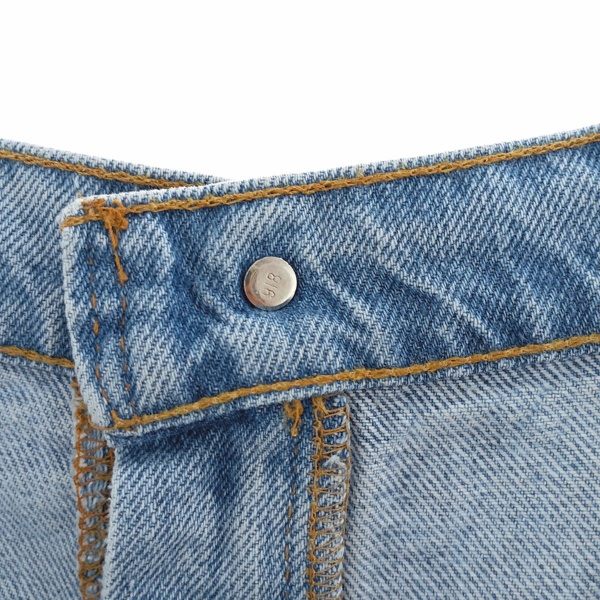 オレンジタブ テーパードデニムパンツ