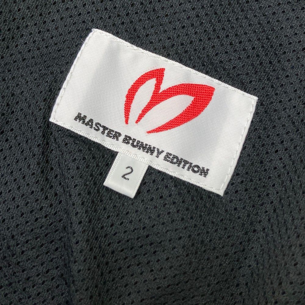サイズ：2 MASTER BUNNY EDITION マスターバニーエディション  ナイロンパンツ  ブラック系 [240101429425] ゴルフウェア レディース ストスト サイズ：2 MASTER BUNNY EDITION マスターバニーエディション