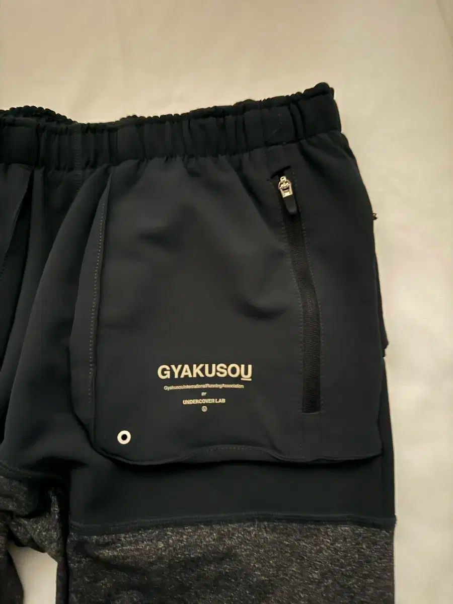 ナイキ x アンダーカバー ギャクソウ ユーティリティ ロングタイツ