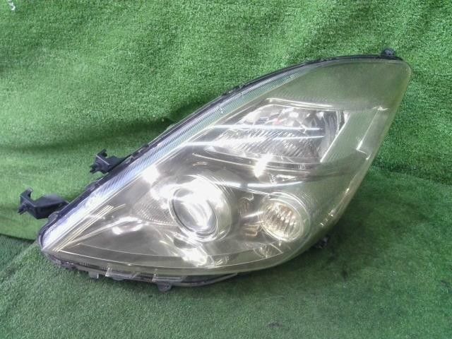 アイシス DBA-ANM10W 左 ヘッドランプ ヘッドライト ASSY プラタナ 1AZ-FSE 3Q3 FK11 81185-44350