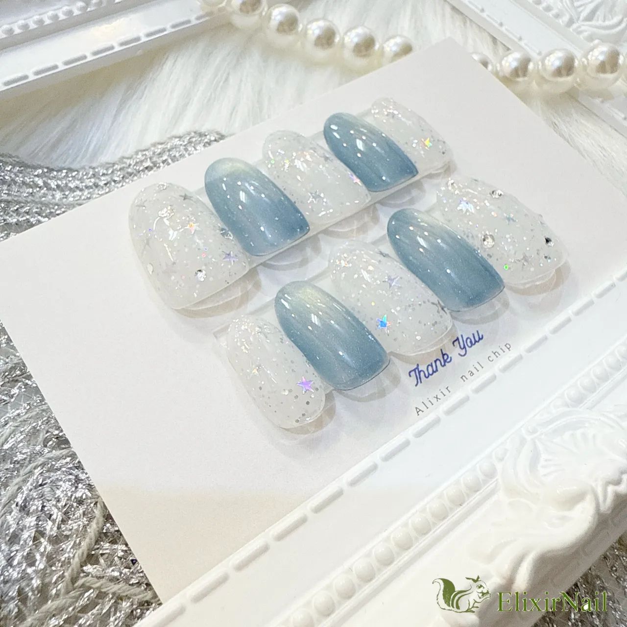 現品】ネイルチップ 水色 白 星 - メルカリ