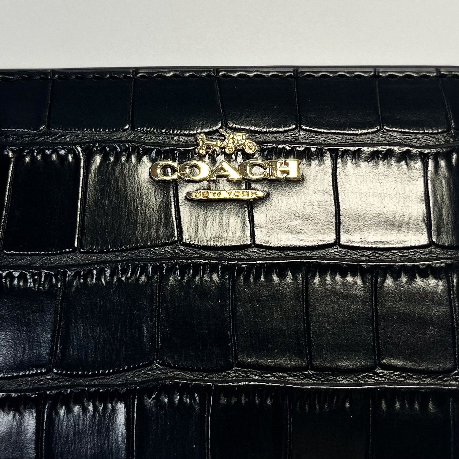 新品・国内在庫】コーチCOACH 折り財布 クロコ型押し ブラック 黒