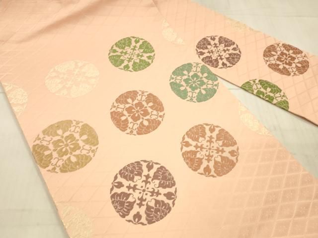 名古屋帯 秀品 鶏頭 地紋 唐織 オレンジ 正絹 中古 反物 秀品 小紋 花唐草 七宝 縮緬 オレンジ 正絹 K30｜中古・古着