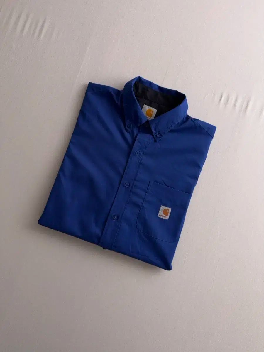 Carhartt(カーハート) リメイク ダークブルー ブラックカラーの裏地 ワンポケット シャツ
