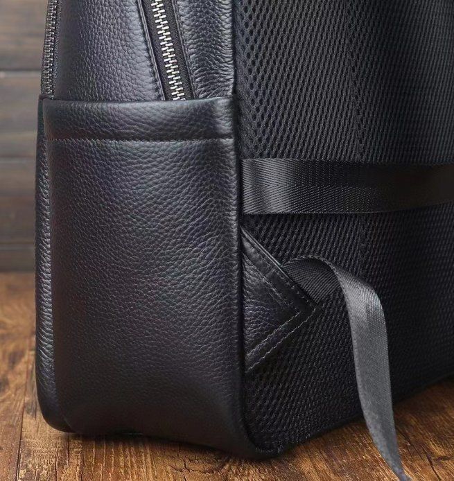 男性のランドセルの新型ビジネスのカジュアルなシンプルなコンピュータのリュックサック牛革の旅行バッグ出張リュックサック頭層