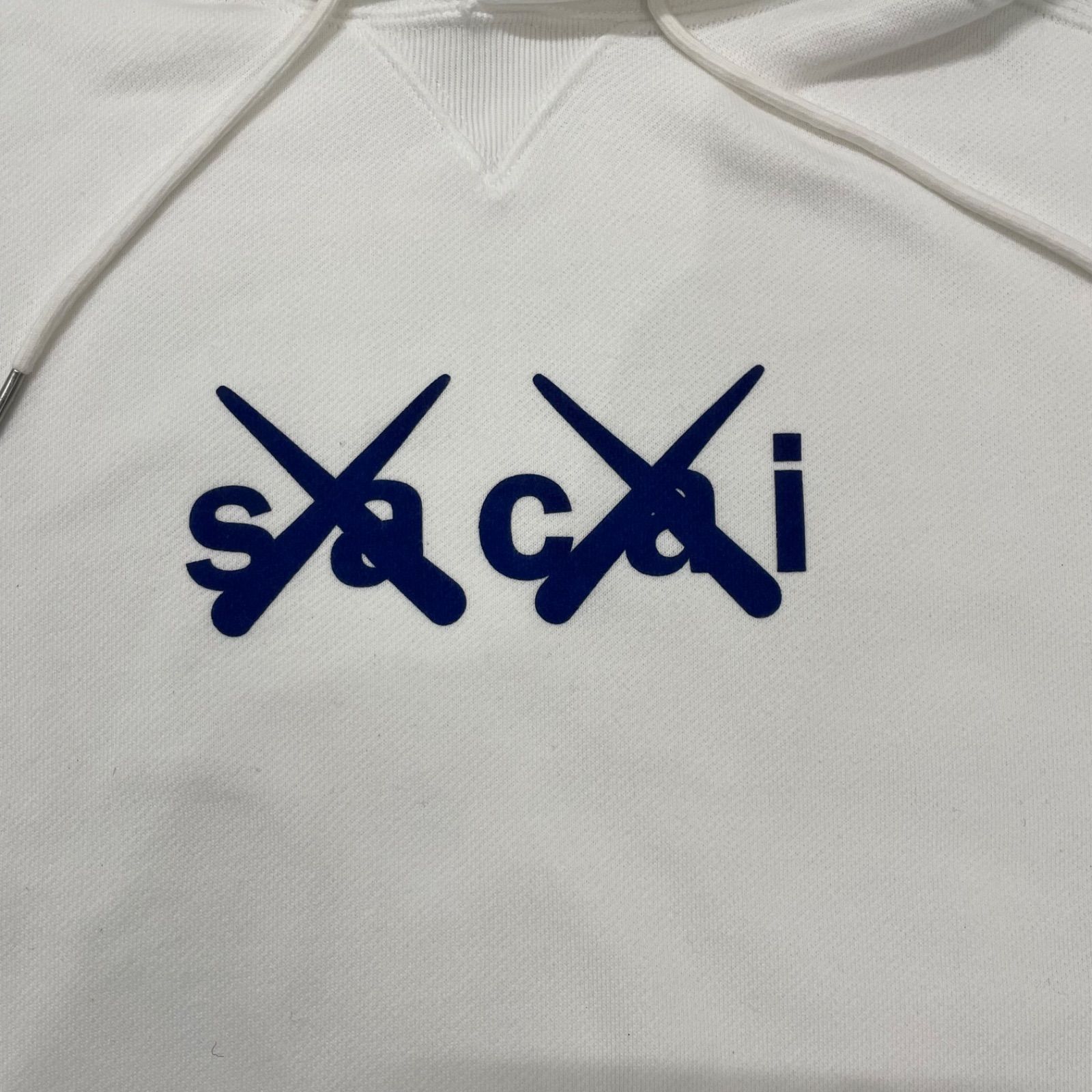パーカー(i)SACAI × KAWS サカイ×カウズ フロッキー ロゴ プリント 