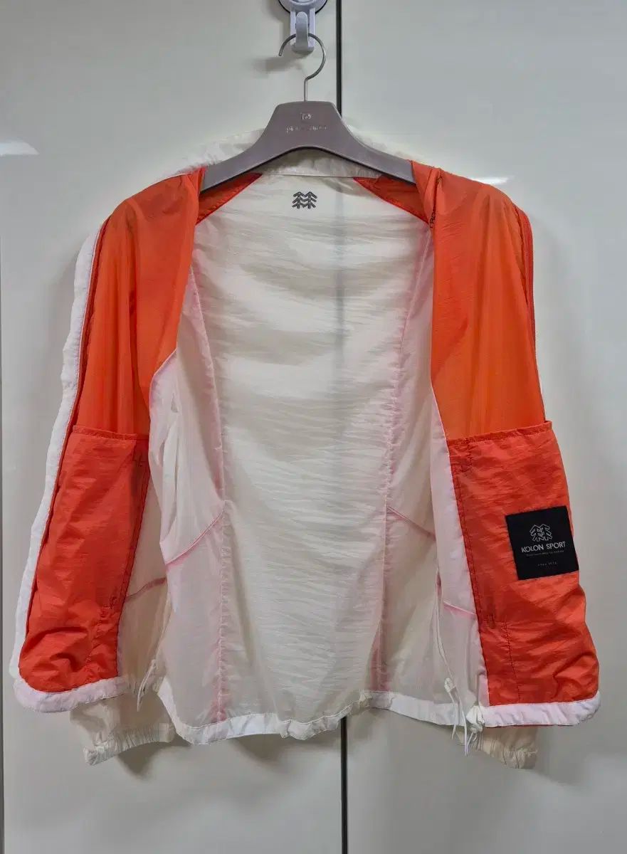 KOLON SPORT フード付きジャケット オレンジ/ホワイト Kolon(コーロン) 軽量ジャケット 【公式通販】