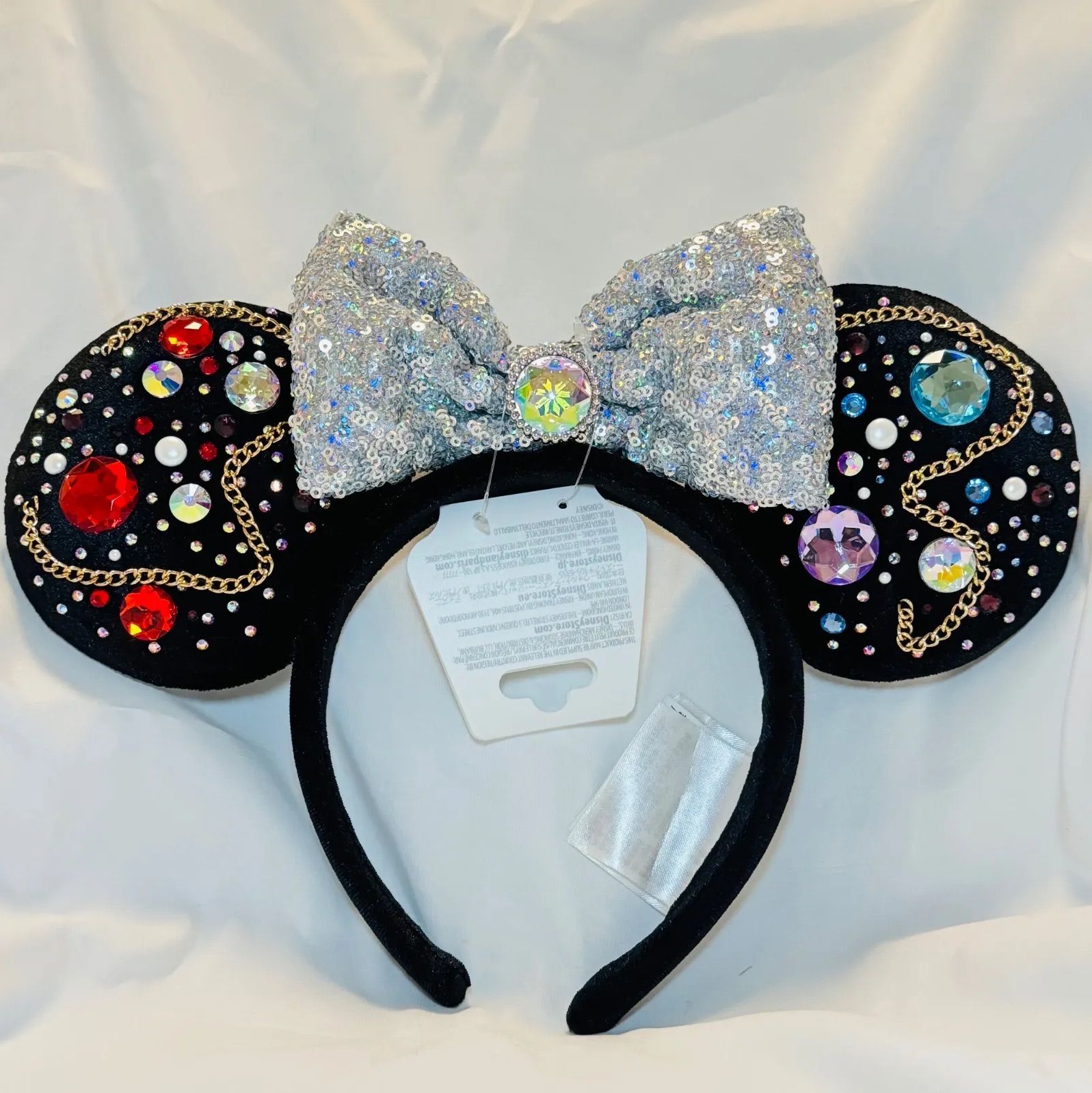 新品未使用】ディズニーランド ミニーちゃんカチューシャ 宝石の