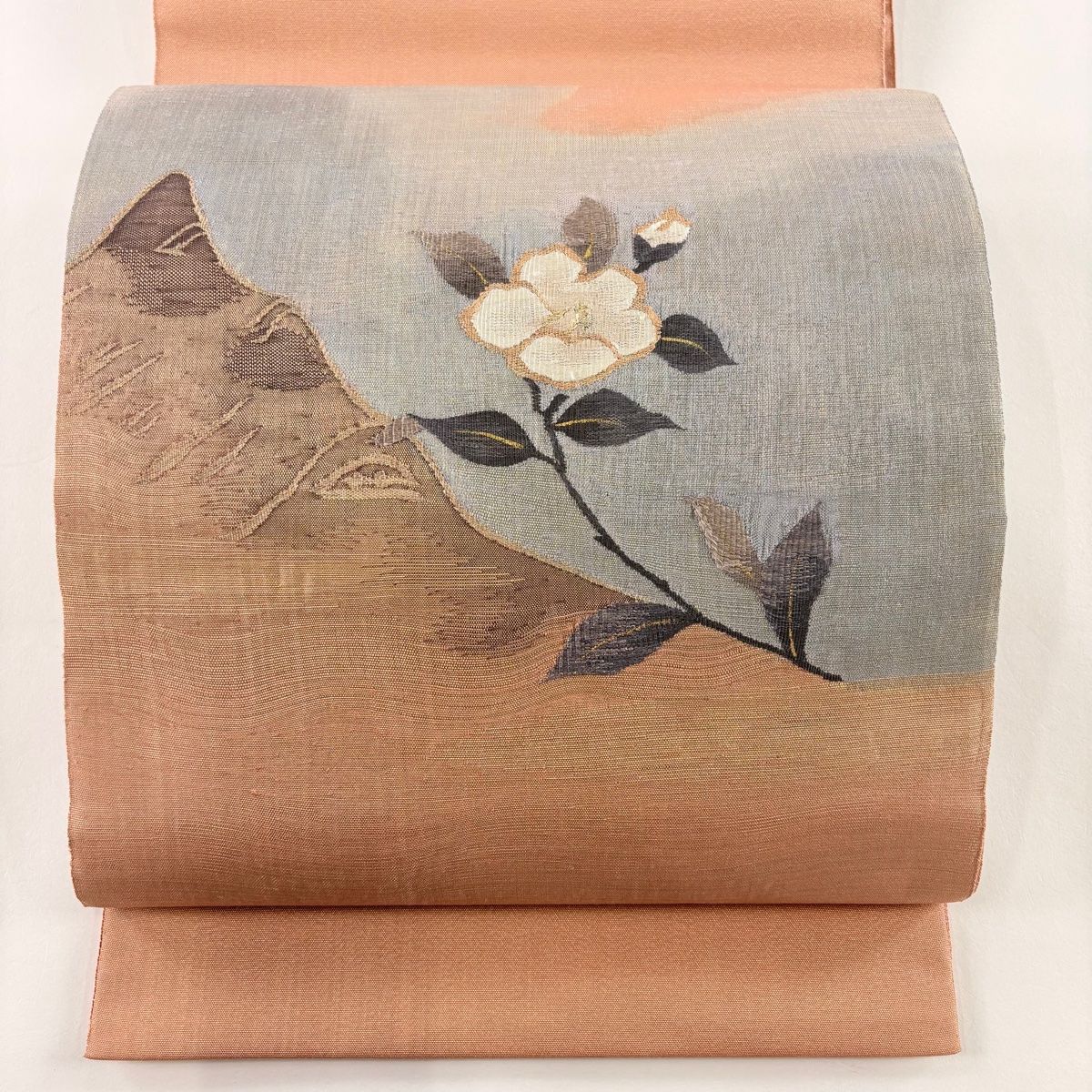 袋帯 秀品 椿 山並み 金糸 綴れ 薄オレンジ お太鼓柄 正絹