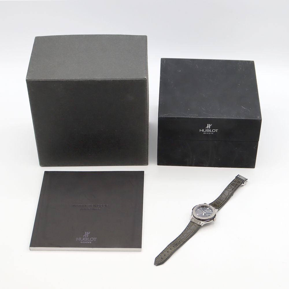 電池交換済 HUBLOT ウブロ クラシックフュージョン チタニウム 581.NX.7071.LR デイト 100m防水 グレー Ti チタン 純正ベルト 純正尾錠 レディース クォーツ【6ヶ月保証】【腕時計】【中古】 HUBLOT - 電池交換済 HUBLOT ウブロ クラシックフュージョン