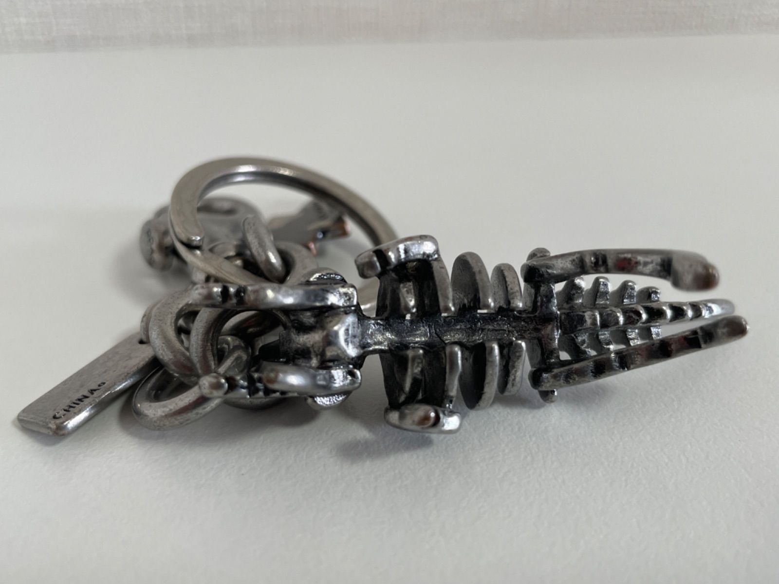 ten. コーチ　キーホルダー　恐竜　ダイナソー ダイナソー バッグ チャーム（キーホルダー）｜COACH（コーチ