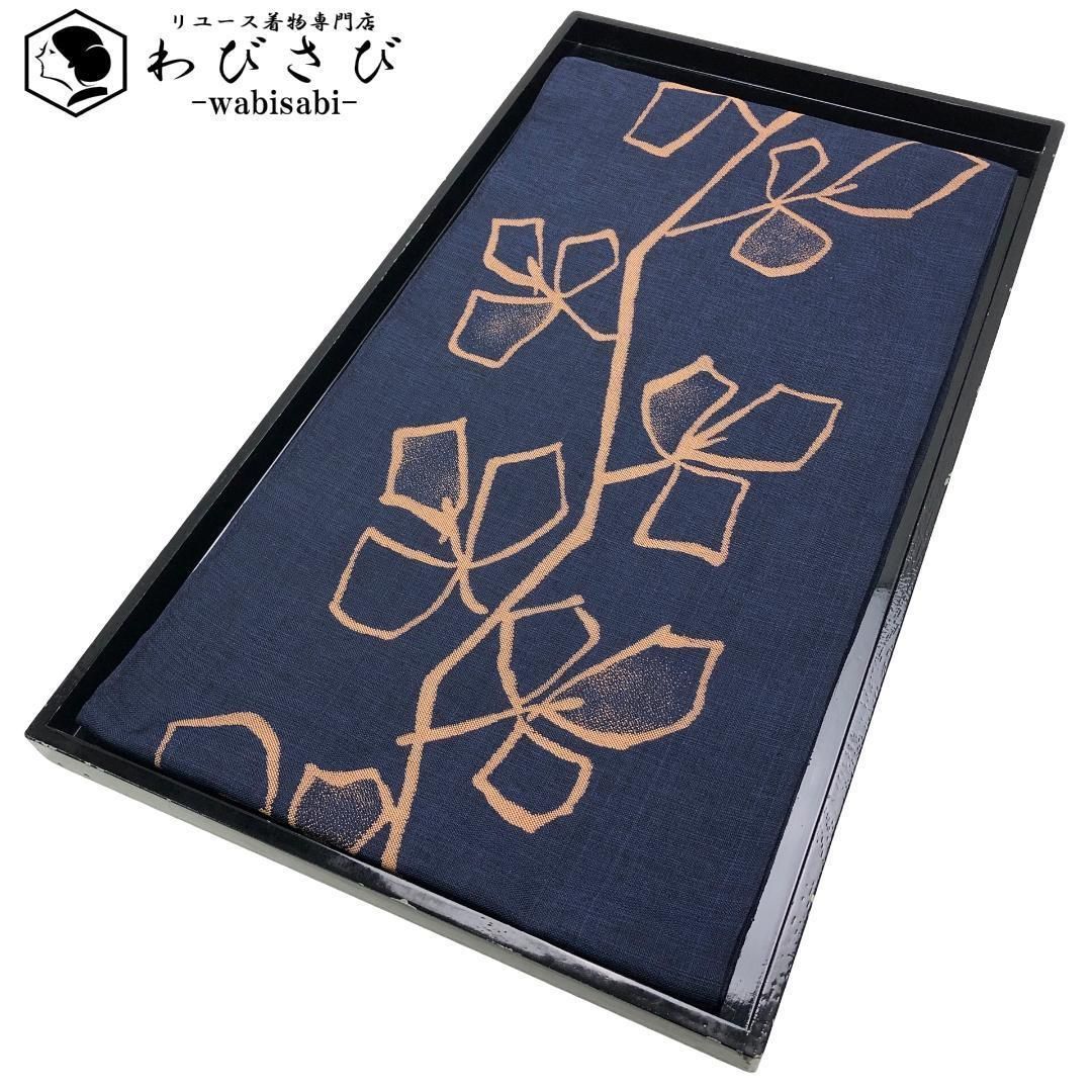 袋帯 花唐草模様 英字の格子柄 媚茶色 ガー O-5474