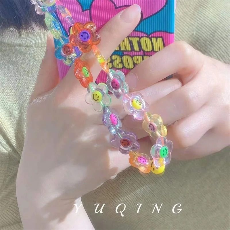 レトロなフラワーニコちゃんスマホストラップ♡ - メルカリ