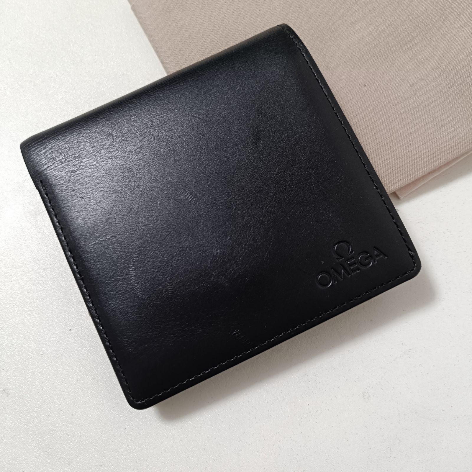 オメガ 本革レザー 二つ折り財布 ブラック 美品 - メルカリ