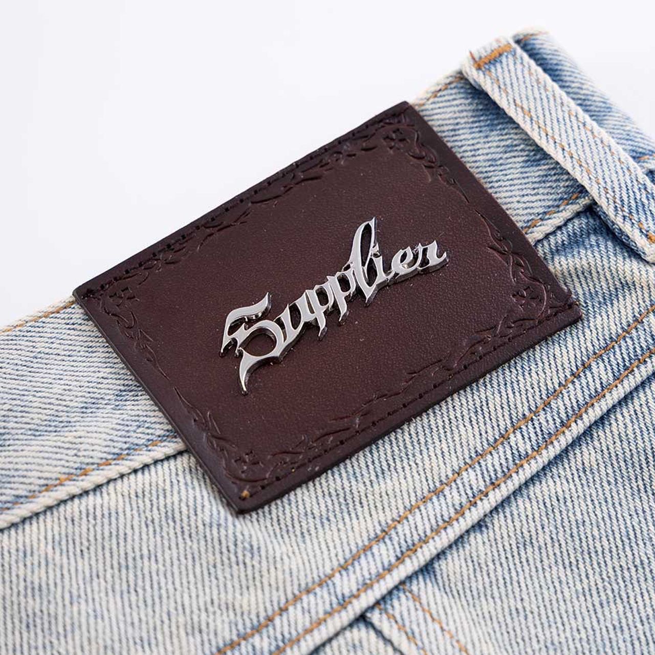 SUPPLIER サプライヤー Cross Leather Patch Baggy Denim Pants