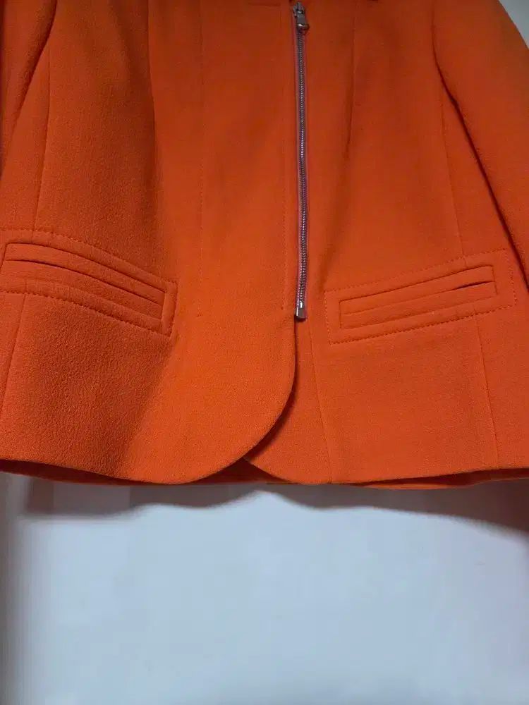 オレンジ ジップアップ