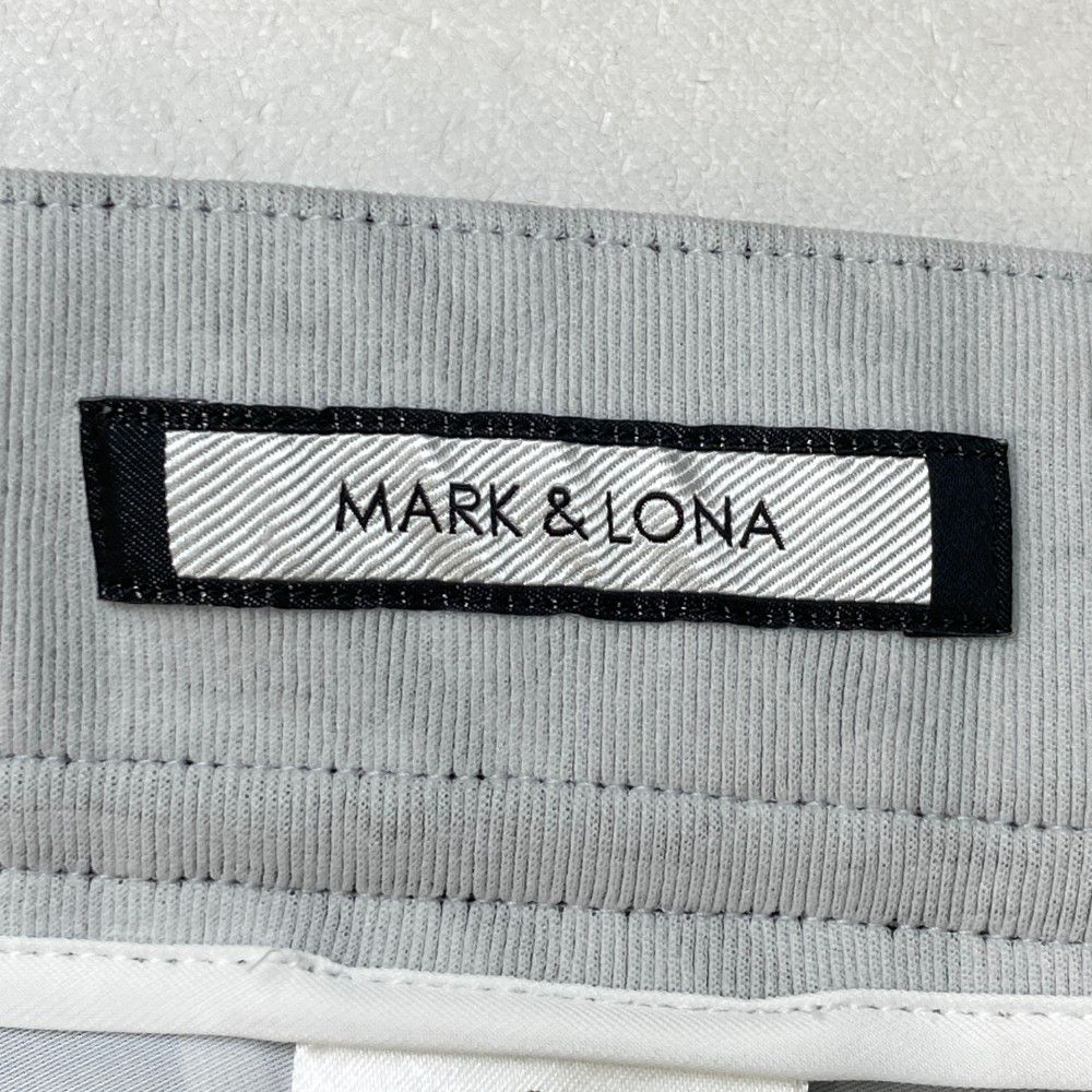 サイズ：48 MARK&LONA マークアンドロナ ; ストレッチパンツ ロゴ総柄 ホワイト系 [240101461283] ゴルフウェア メンズ ストスト サイズ：48 MARK&LONA マークアンドロナ ; ストレッチパンツ