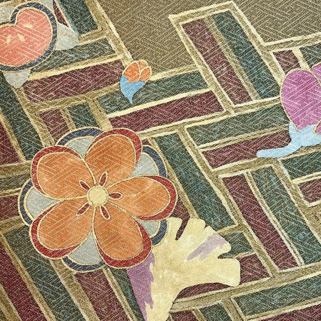 袋帯 作家物 檜垣に花模様 紗綾形地模様 璃寛茶色 銀通し O-4139  